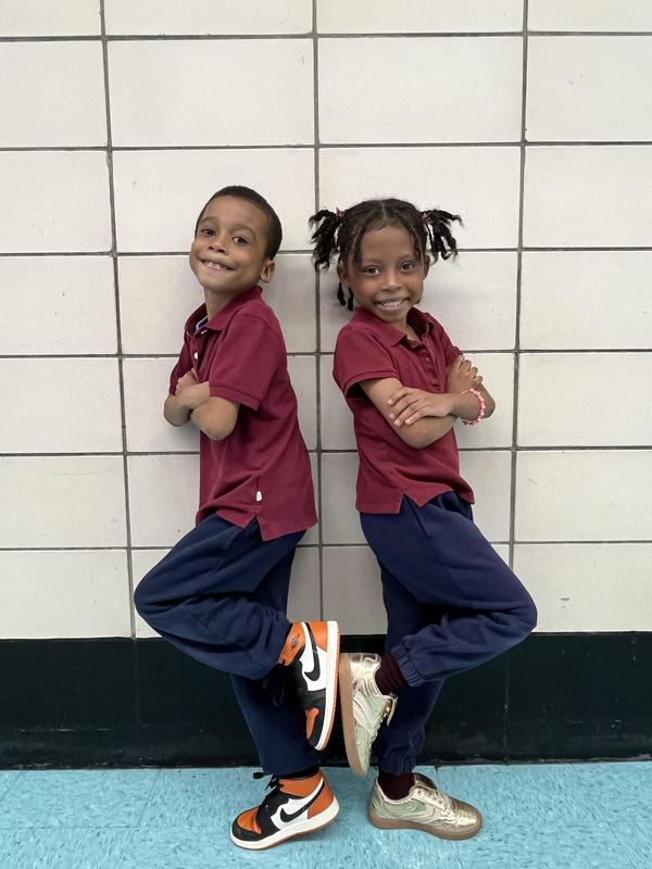 Twins matching in red polos!