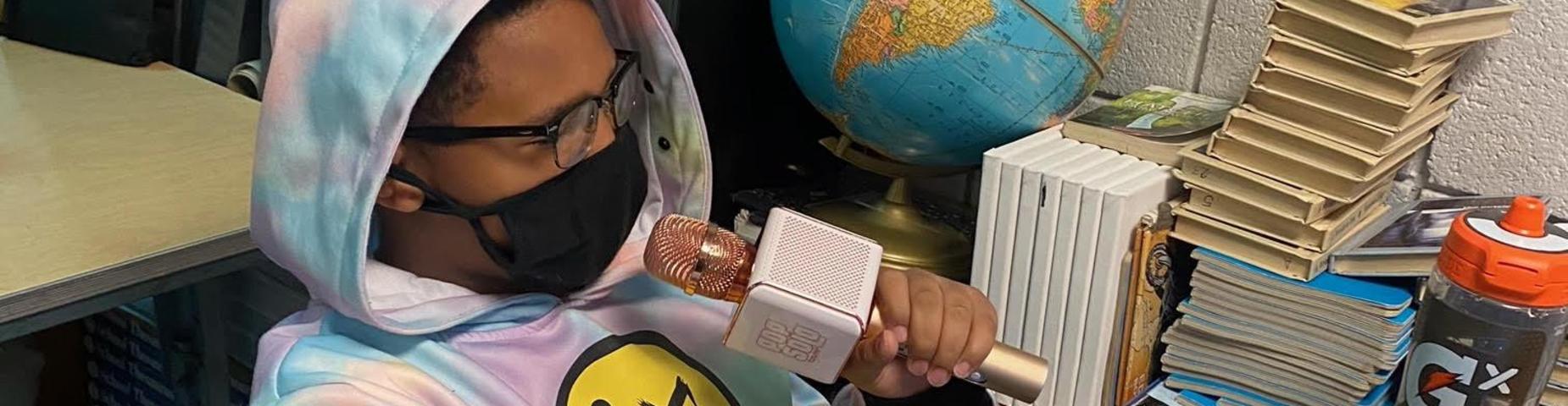 Using a microphone to read.