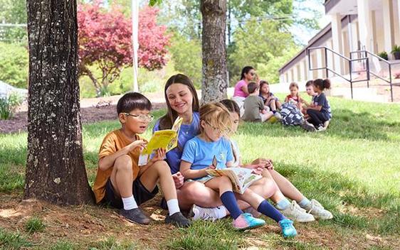 Eighth graders "buddy read" with first graders at James River Day School.