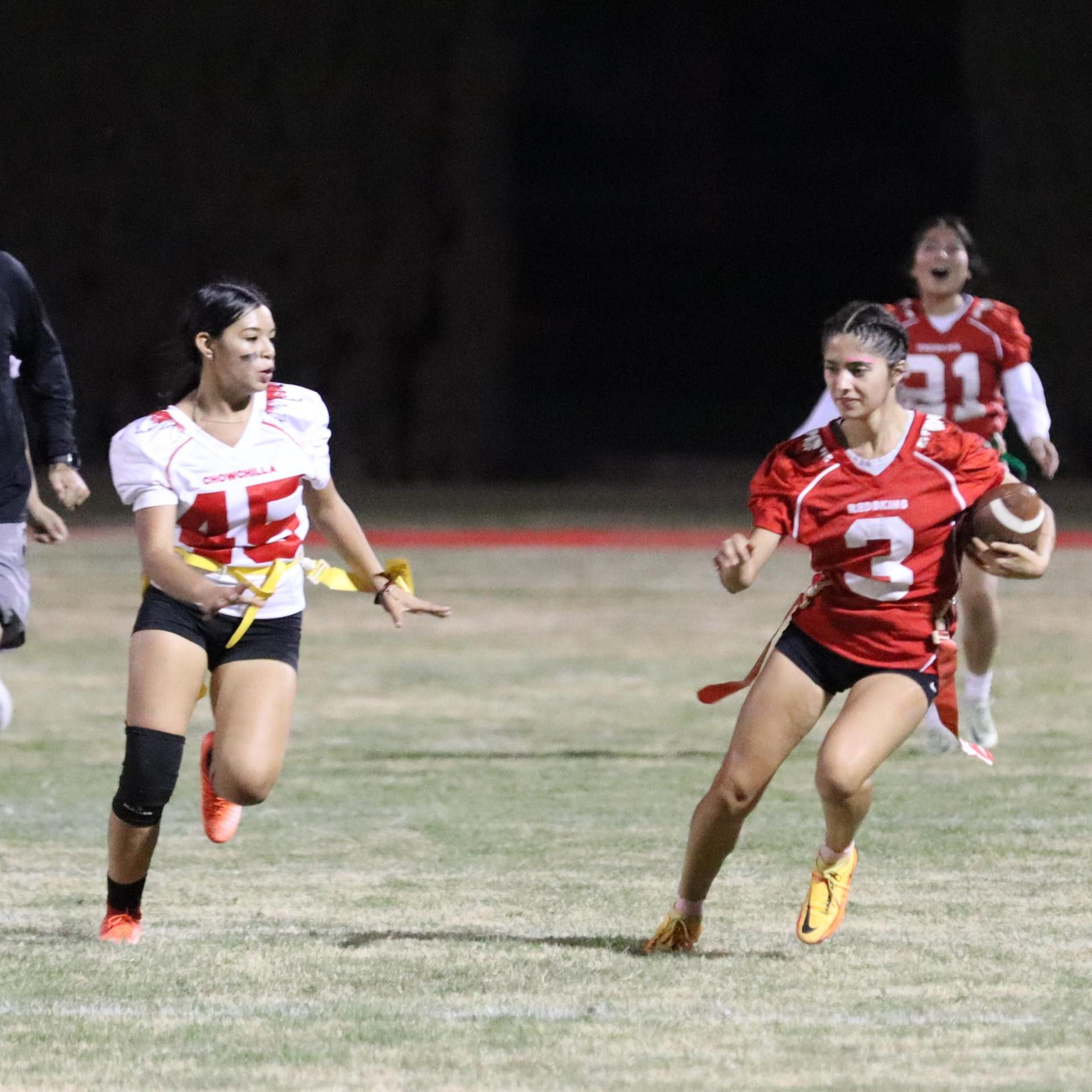 girls playing flag football