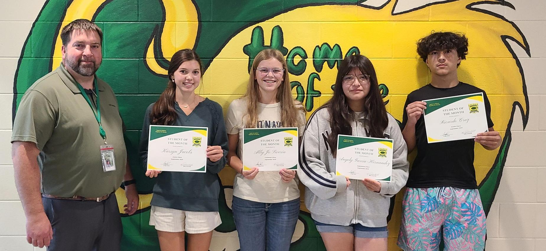 September students of the month Abby Jo Sevrin, Angely Garcia-Hernandez, Karsyn Jacobs and Rick Cruz with principal Craig Fisher