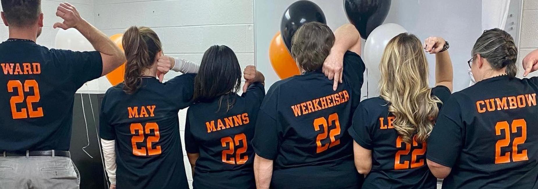 image of CES office staff and principals wearing jerseys with the number 22 on 2-22-22