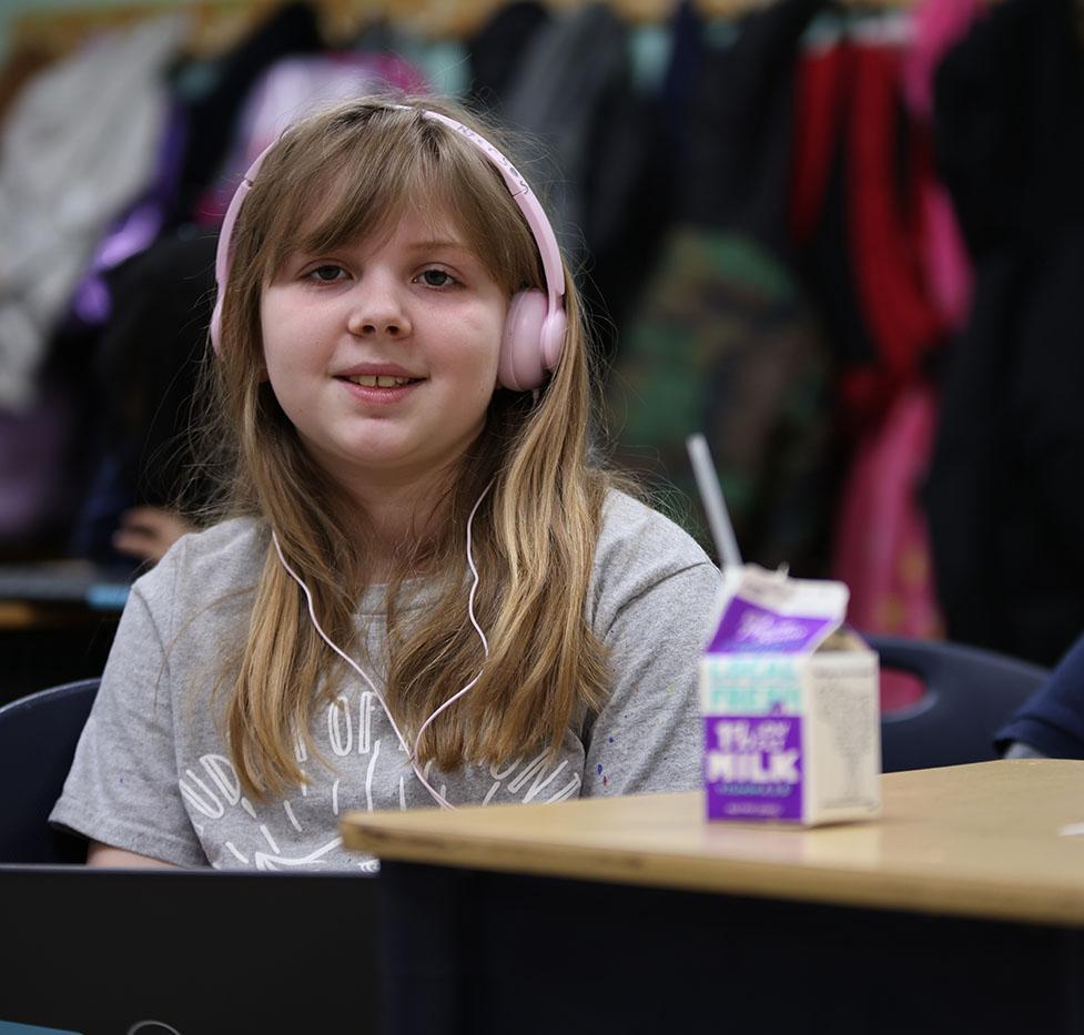 Student sitting at a desk in the classroom