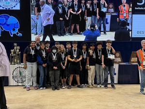 Bonham MS Robotics team accepts its Rookie Bowl plaque