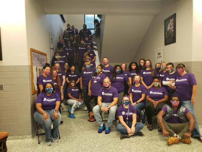 Image shows the Mandela team posing in a stairwell