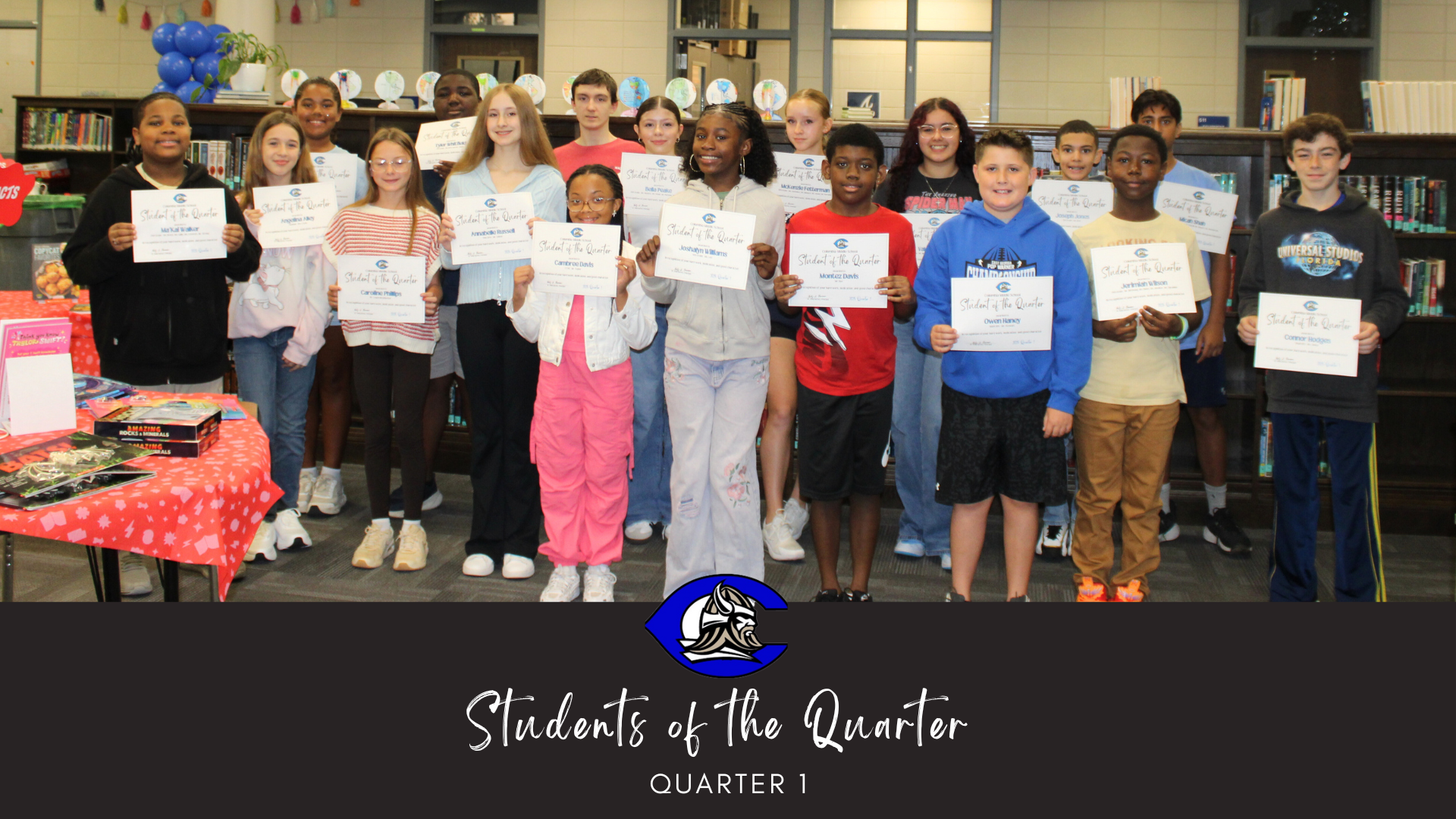 A group of students holding certificates celebrating their achievement of being nominated as Student of the Quarter.