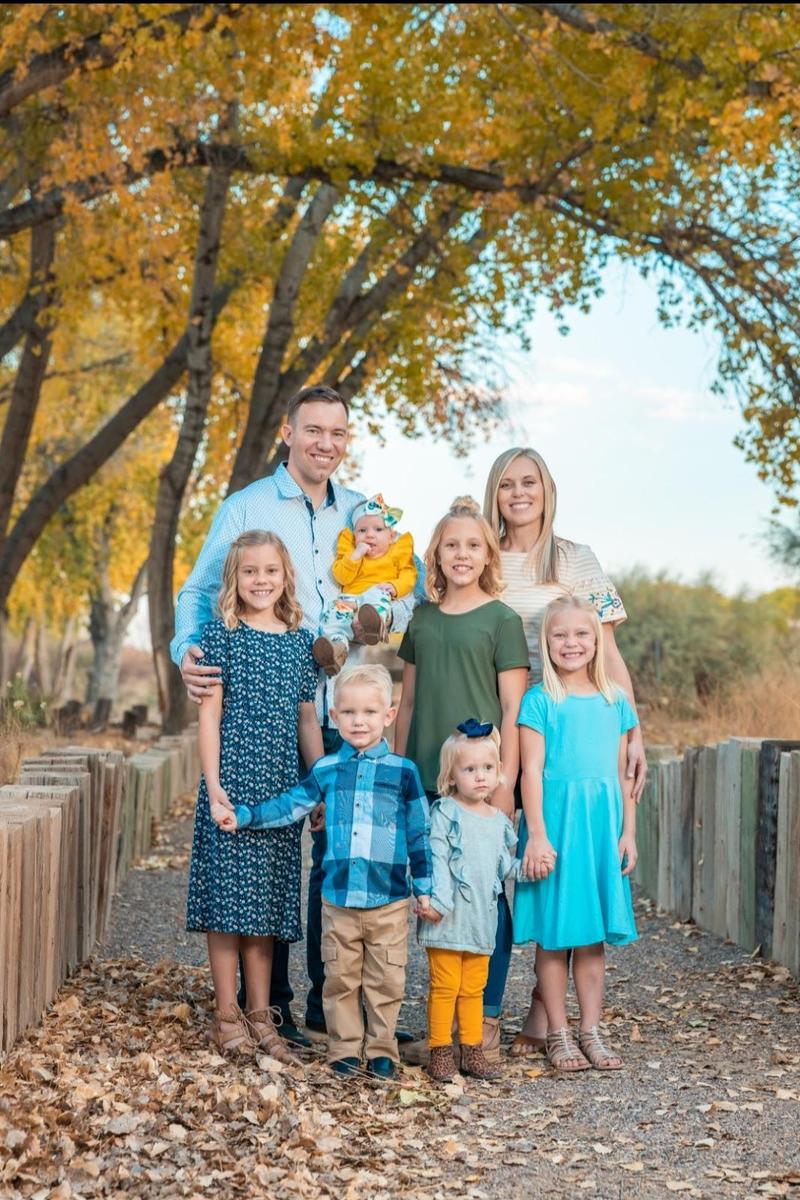 Jailin Solomon and family with husband, and six small daughters.