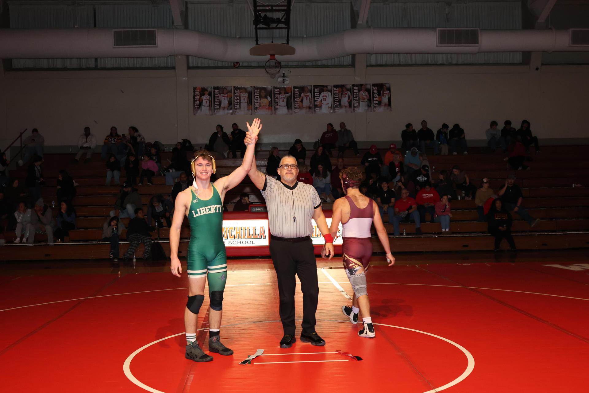 Wrestling winners with hands up 73