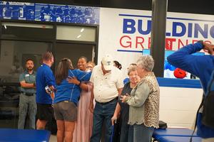 Skrabanek hugs former student trainer and current board member Bre'Lashyia Alexander