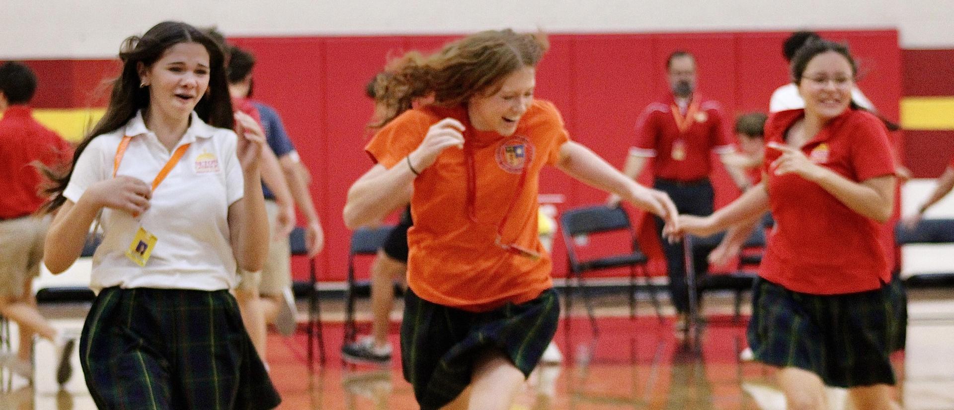 Students running in the gym
