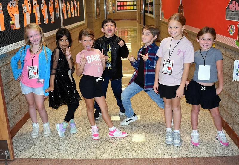 Students completing reading and math activities.