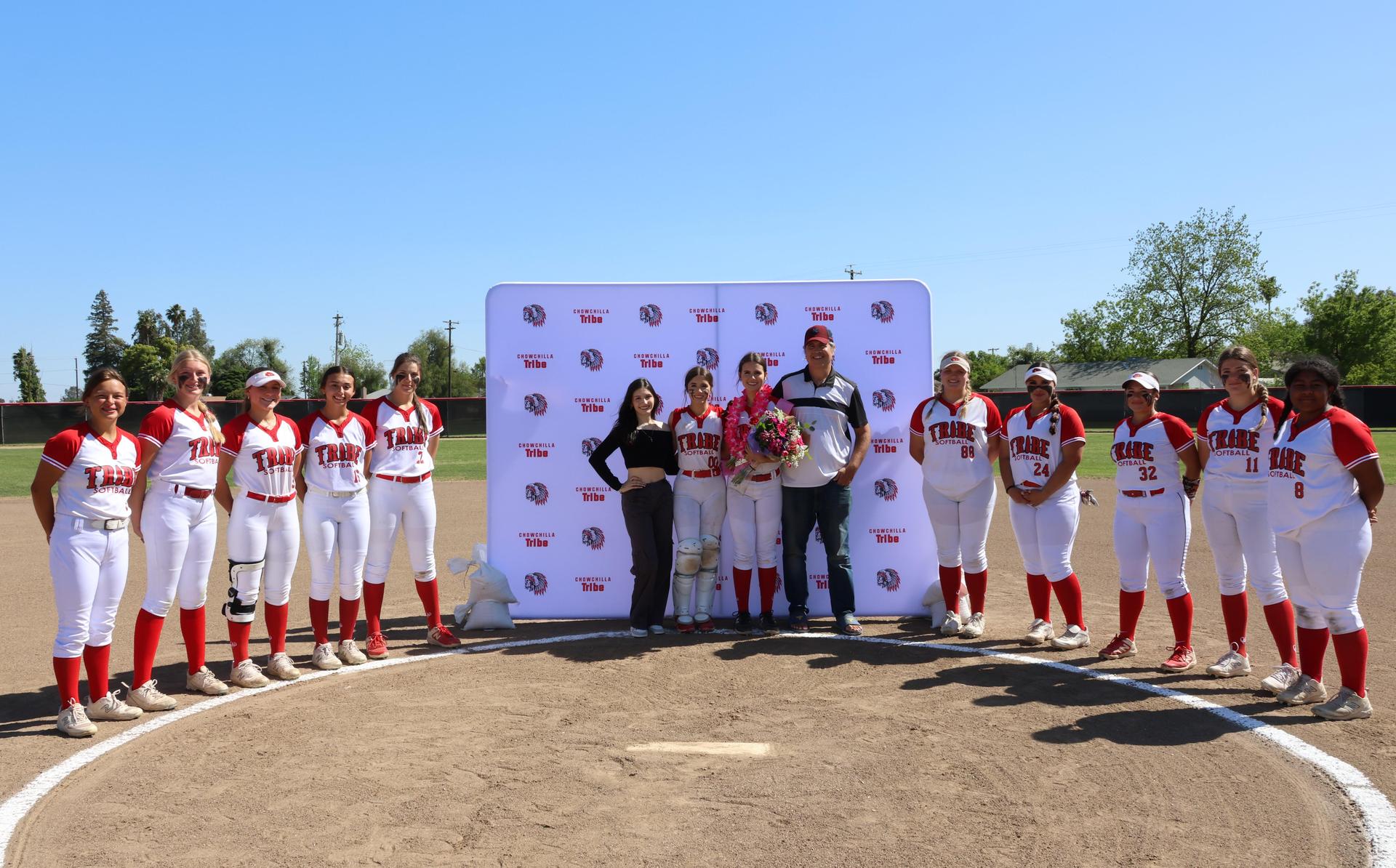 Seniors Posing With Teammates, Coaches, And Family