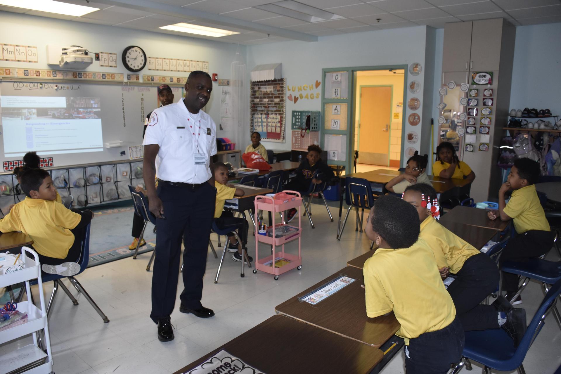 Fireman speaking to students