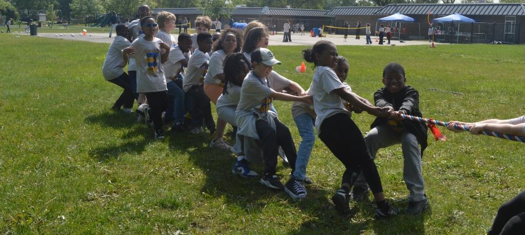 students pull on tug-o-war rope