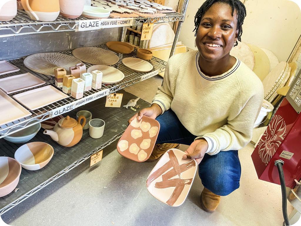 Student with Pottery
