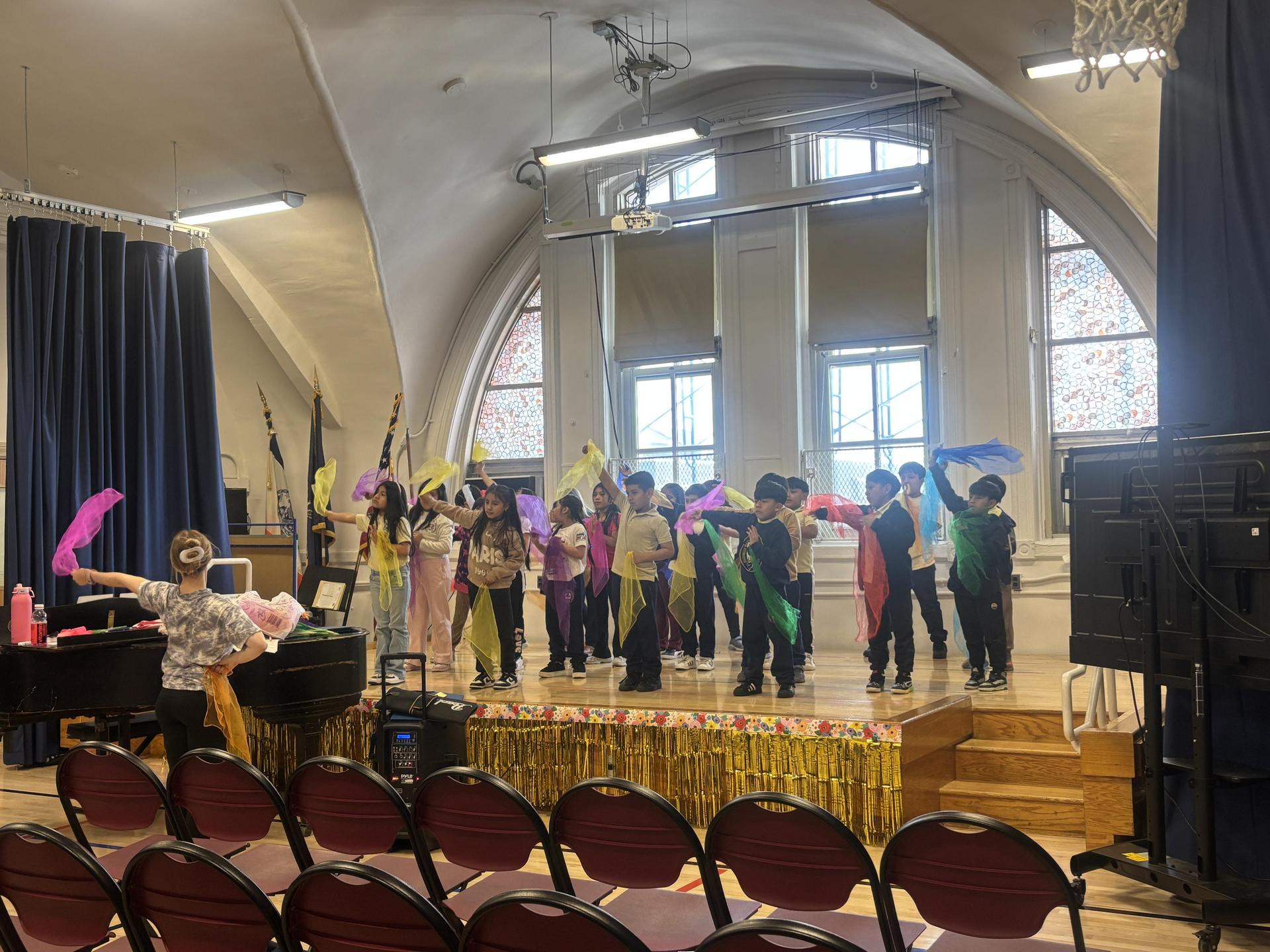 group of students dancing on stage