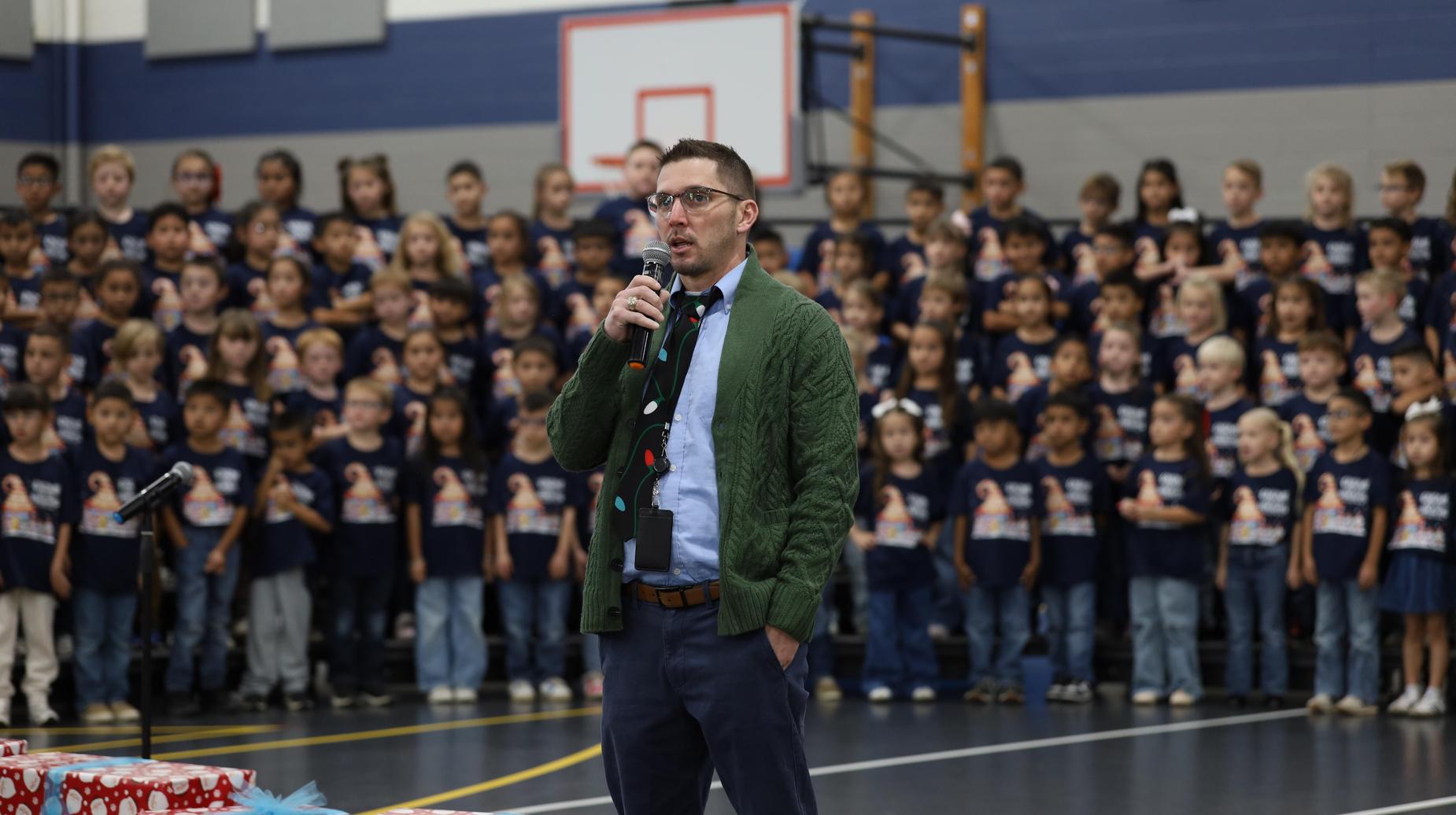 Dr. Hawkins speaking during the Gnome Place Like Home 1st Grade musical