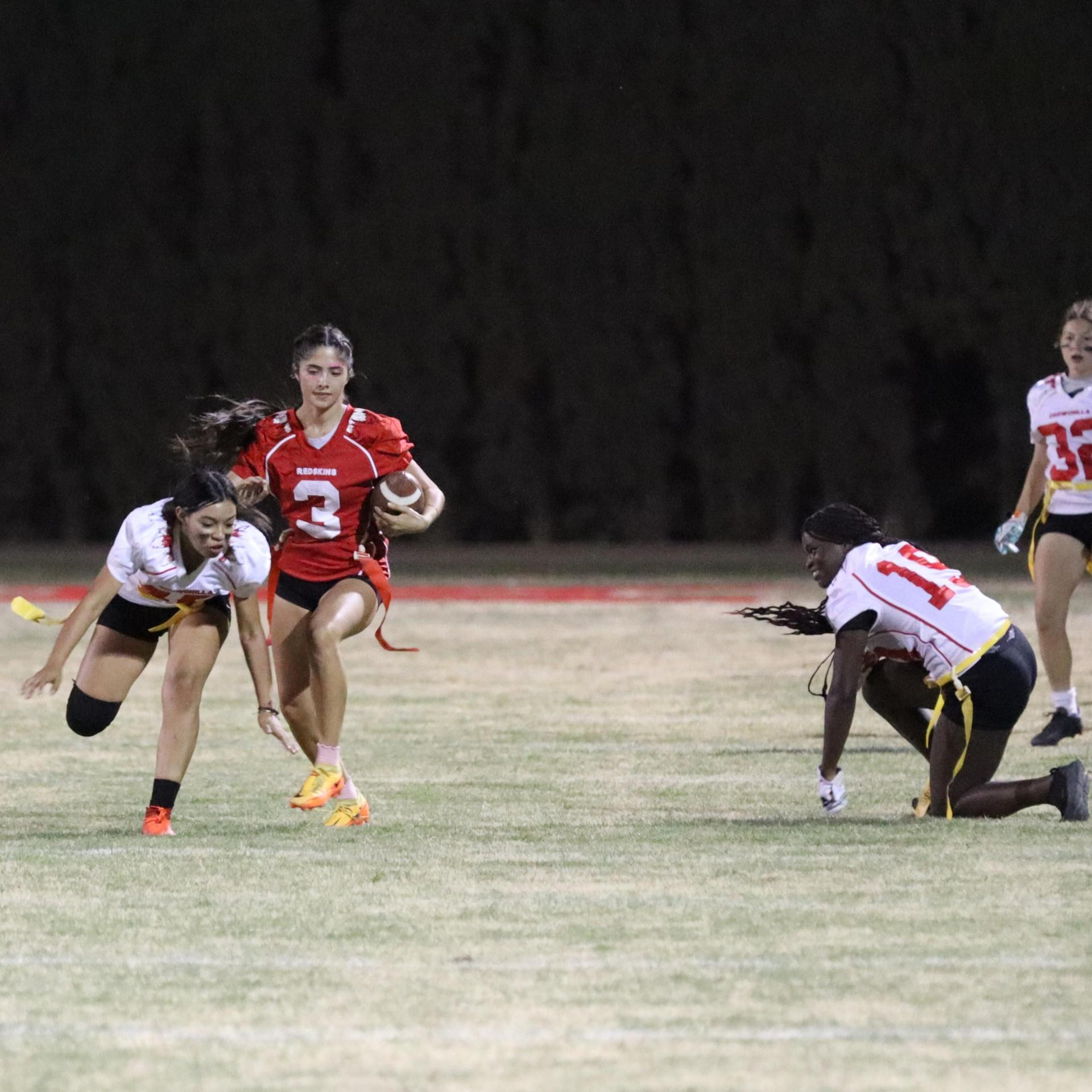 girls playing flag football