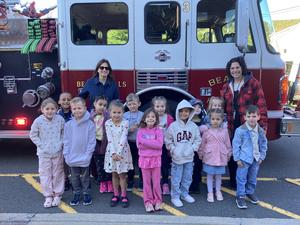 students teacher and fire truck for fire prevention day