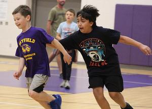 Boys play tag.