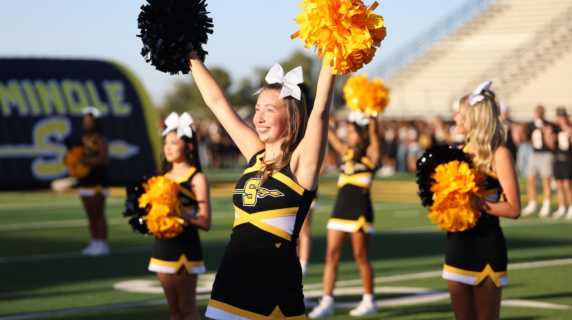 Cheerleaders cheering at Meet the TR1BE