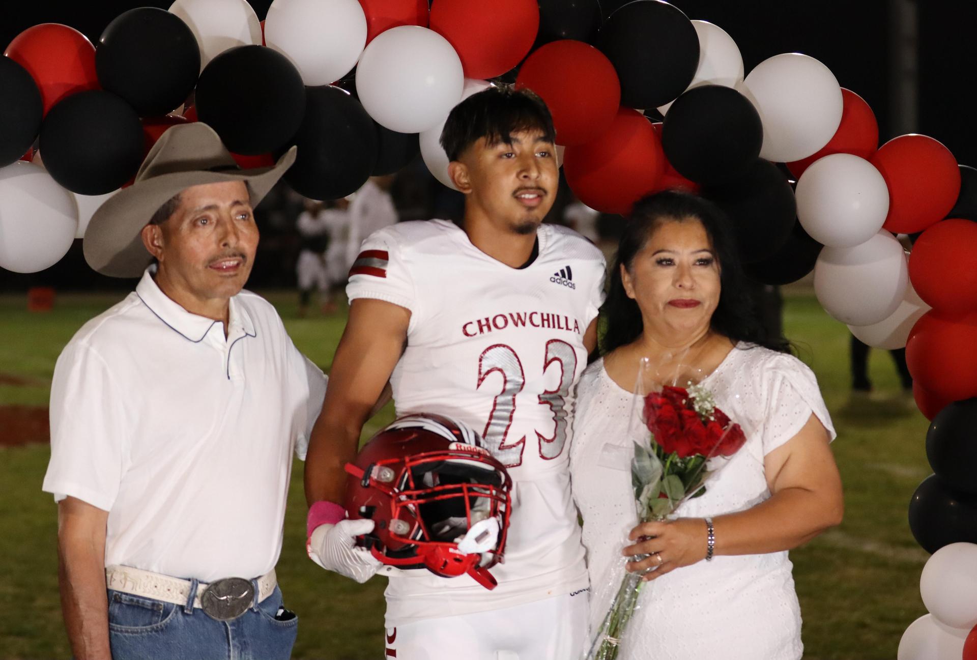 seniors and their escorts celebrating senior night