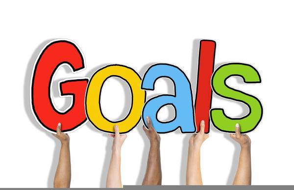 Various hands holding large colorful letters spelling 'Goals'.