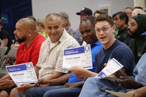Rob Simard displaying his certificate