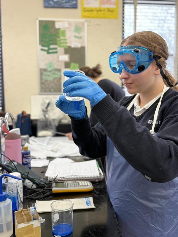student in science class