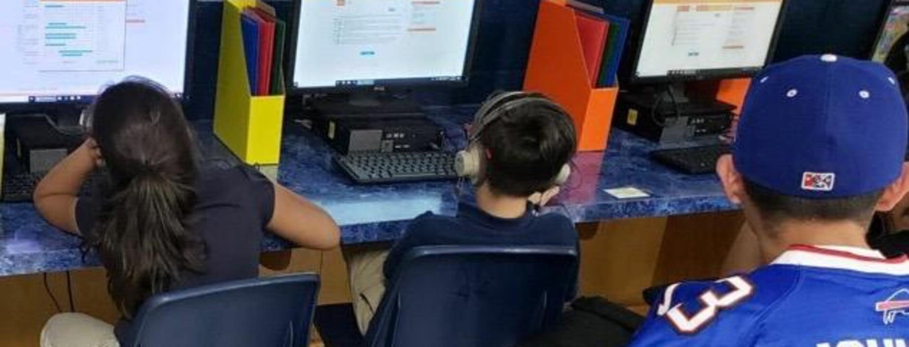 Image of parent visiting computer lab.