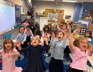 The kindergarten boys catch sight-words in their snowing sight word game!