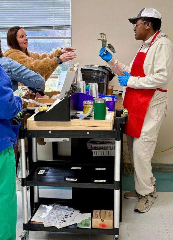 Josh serving customers.