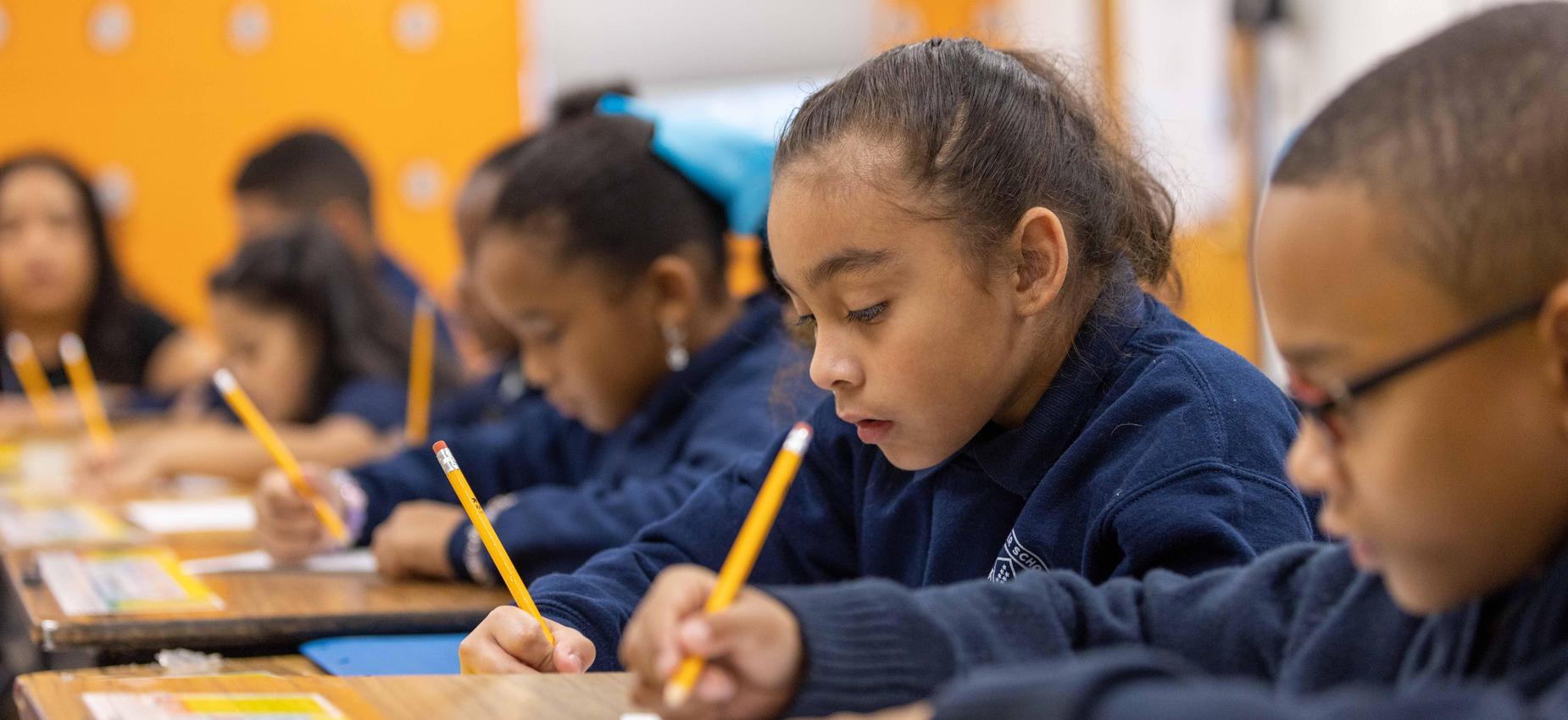 Scholars at work, writing and reading.