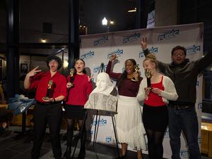 The performers and Mr. Burnes with their awards