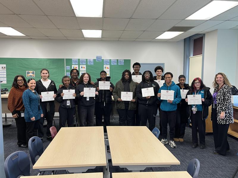 PROMISE students post with School Committee certificates recognizing their achievement