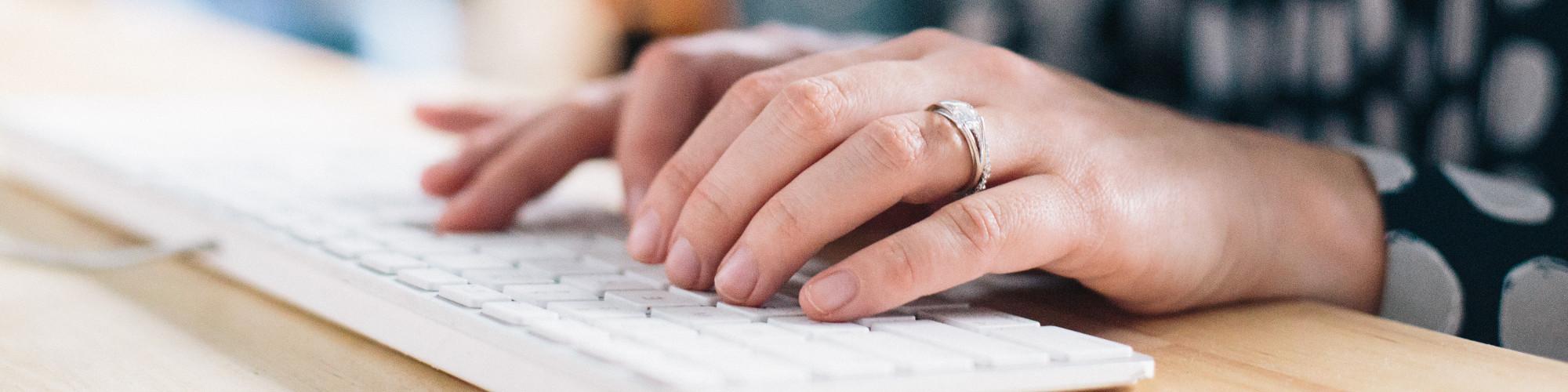 hands on a keyboard typing