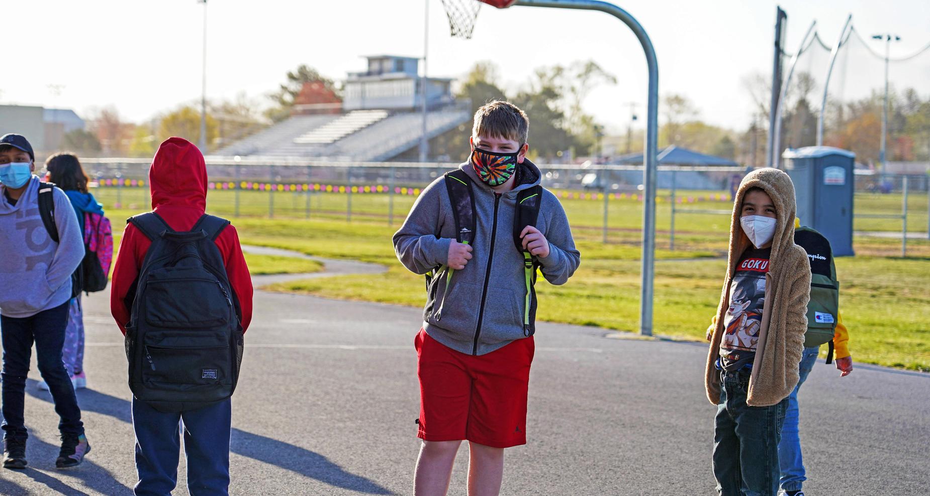Boys standing in the playground area.