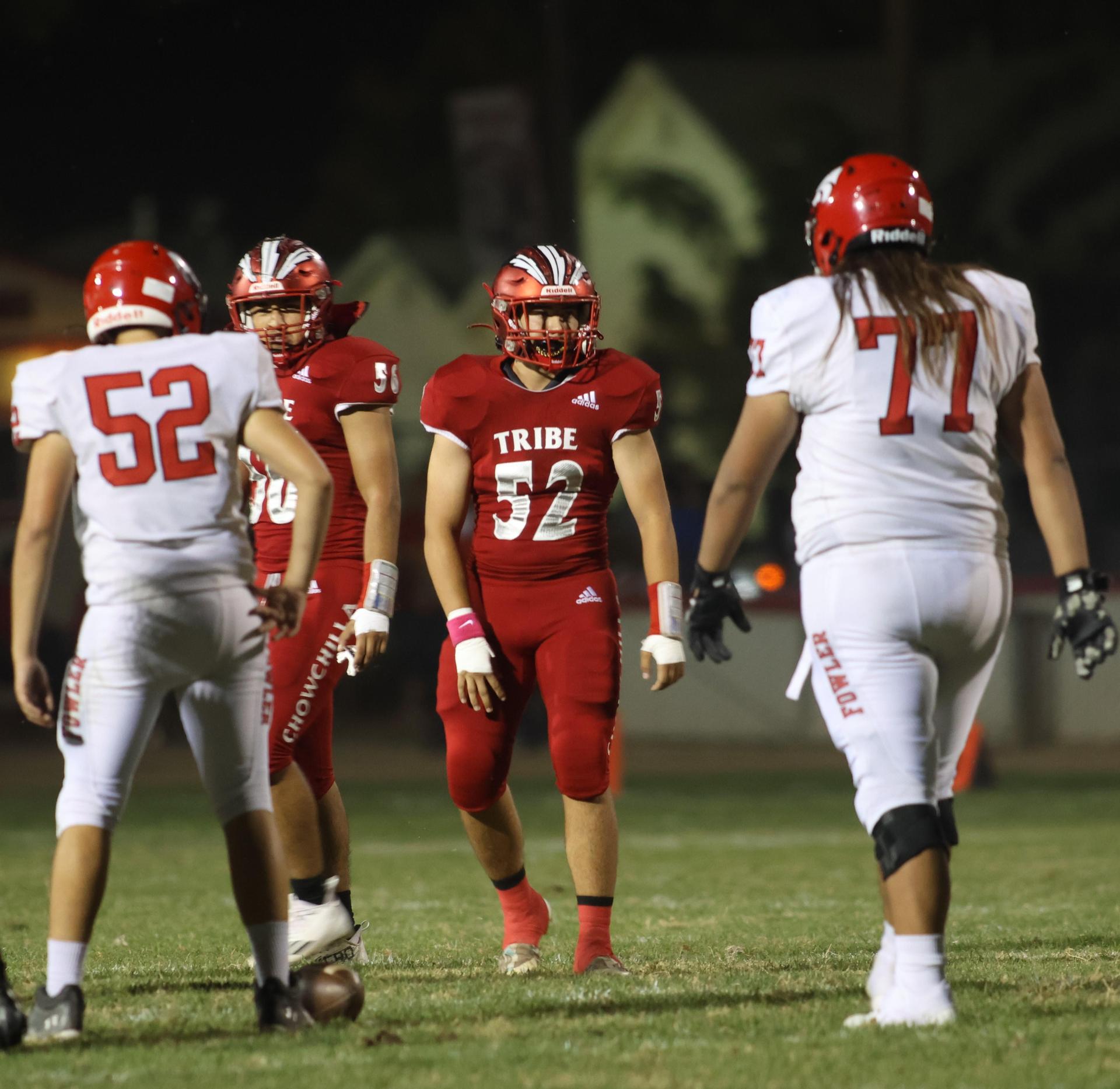 varsity boys playing football against Fowler