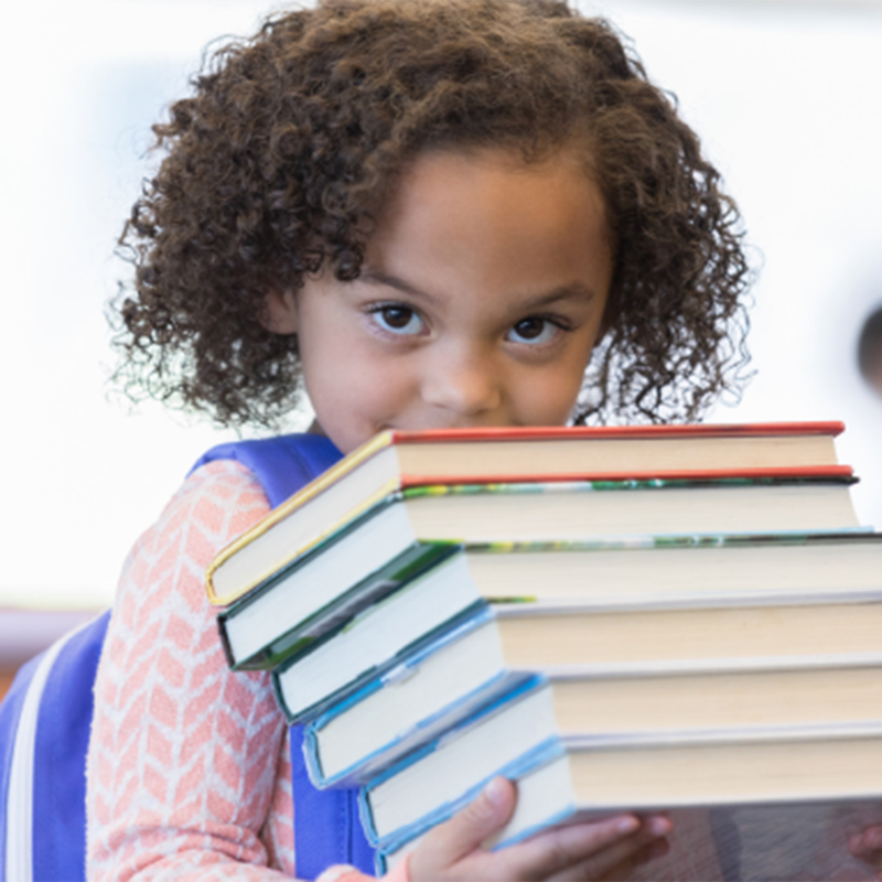 girl holding books