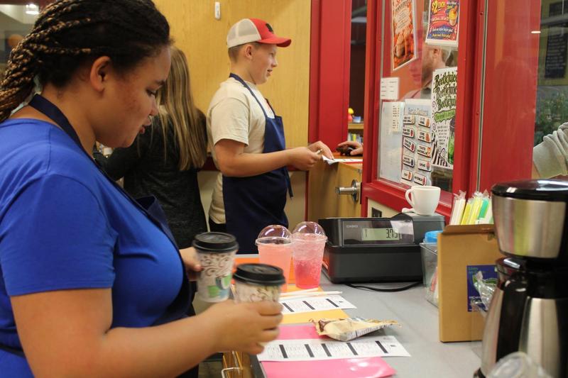 one student takes orders while another makes orders