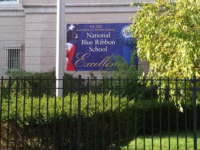 Sign displaying National Blue Ribbon School recognition for P.S. 222.