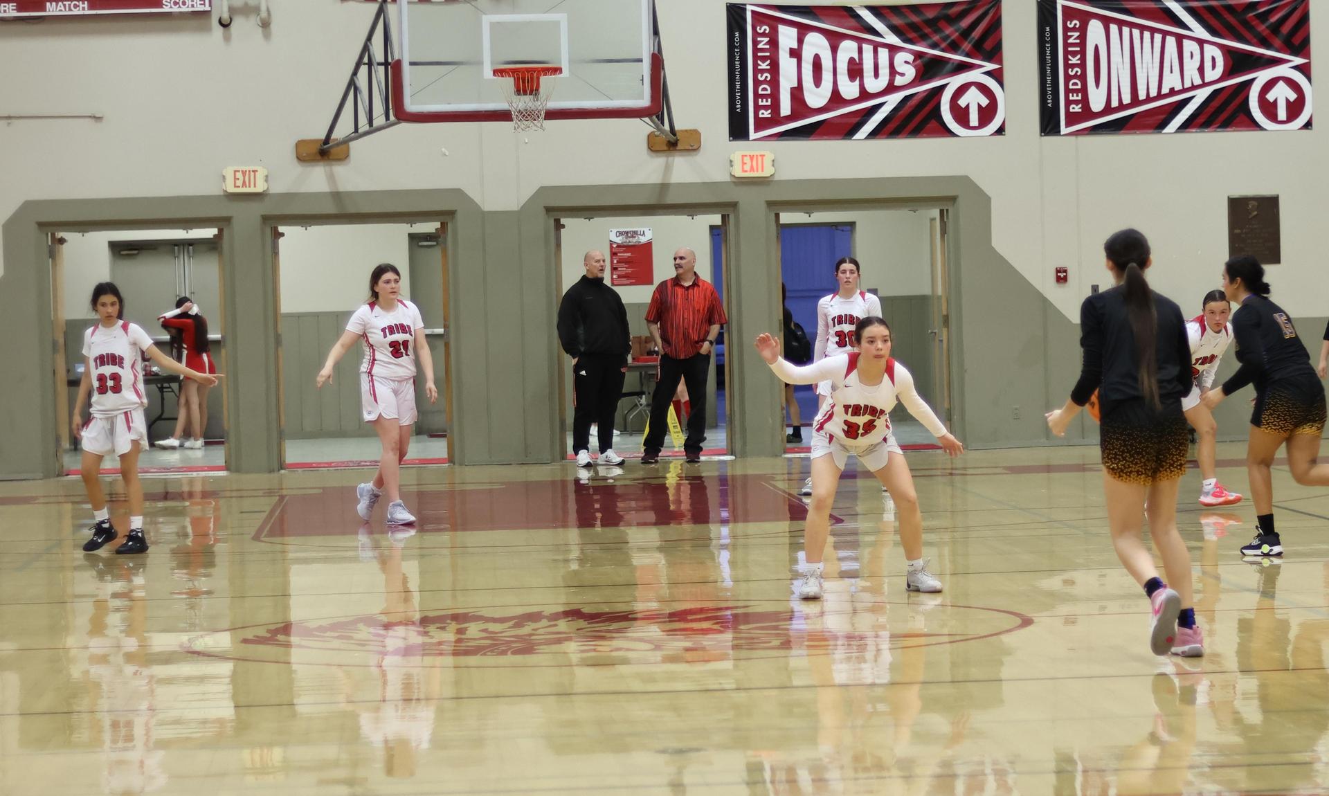 junior varsity girls playing basketball against parlier