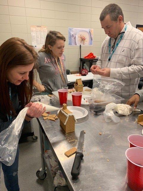 Students making gingerbread houses