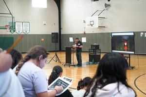 Brad Christy reads a story to students