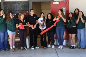 A group of students and staff celebrate after cutting the ribbon during the Wellness Center Reopening at La Serna High School.
