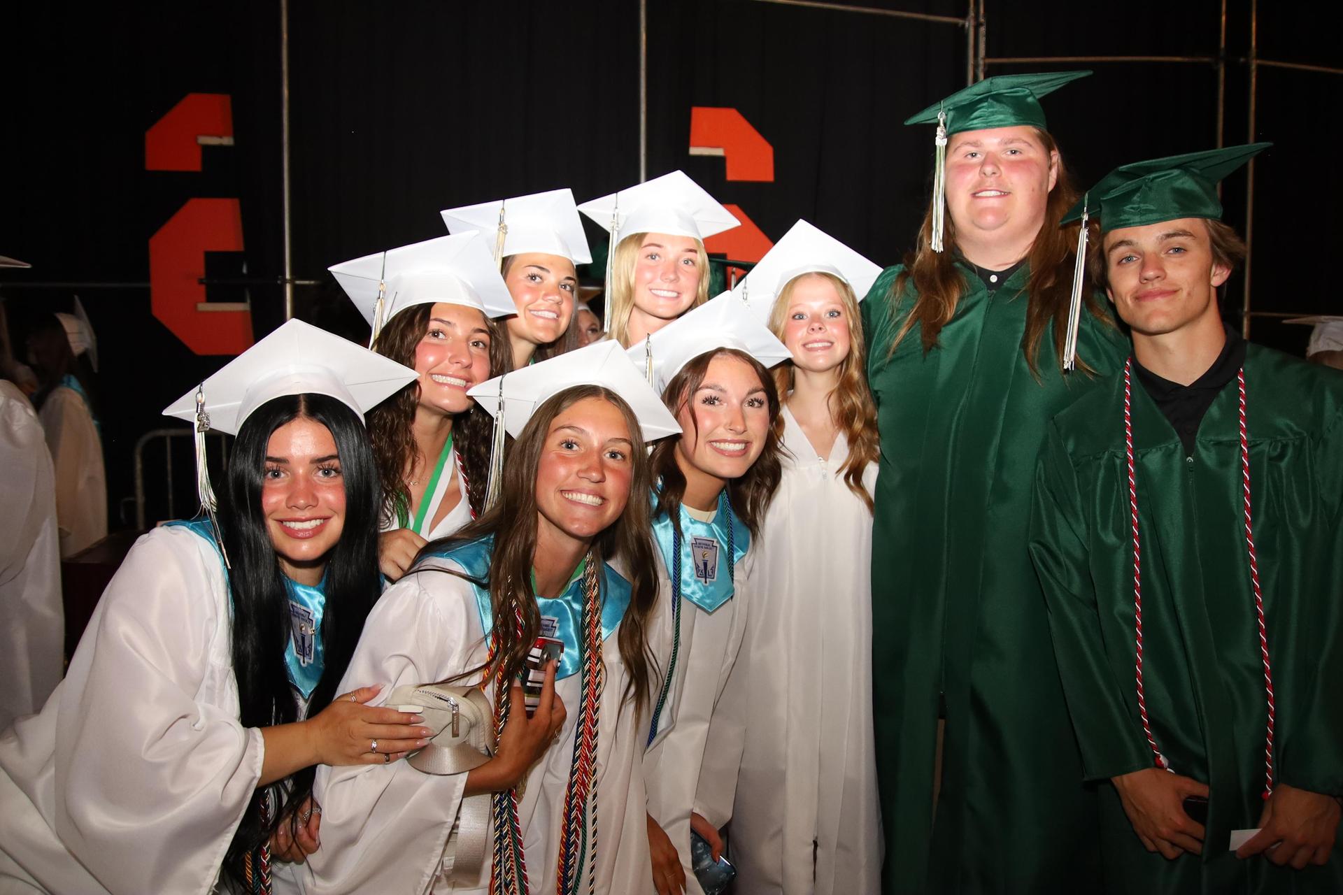 Students smiling at graduation ceremony