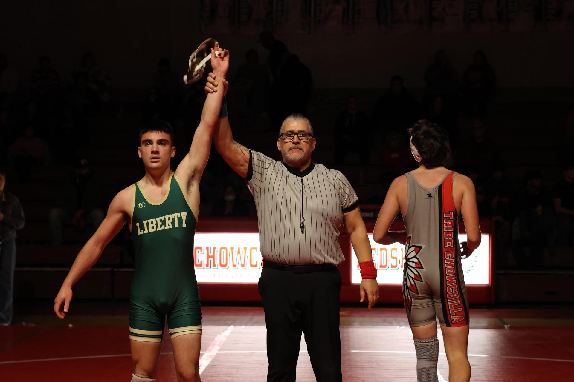 Wrestling winners with hands up 124