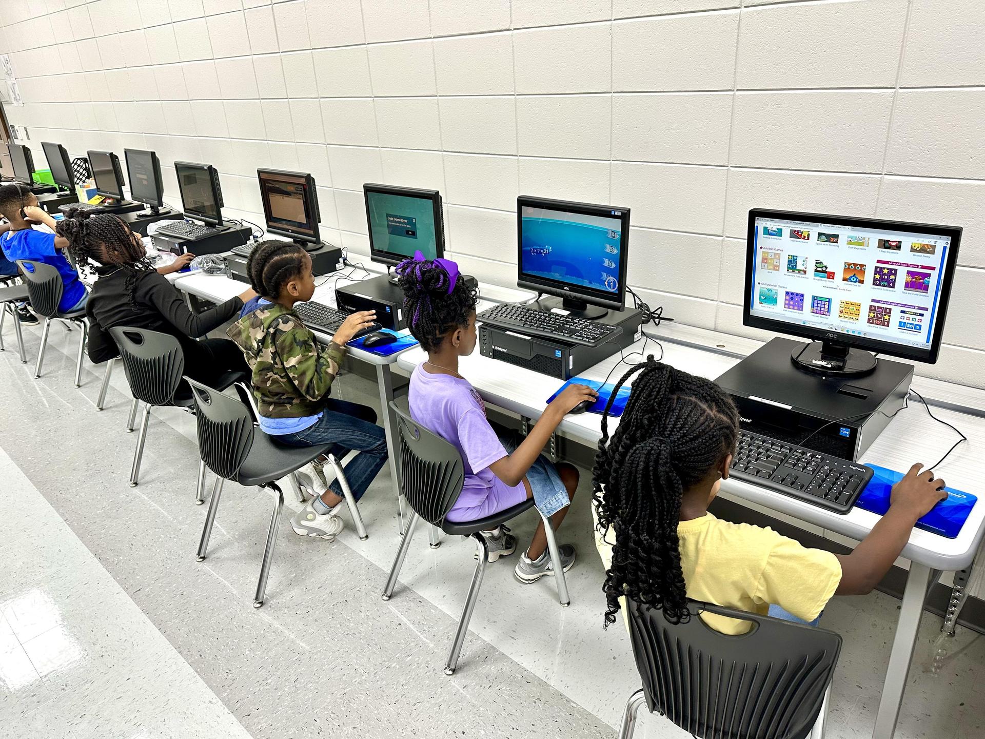 Students working at computers in the tech lab