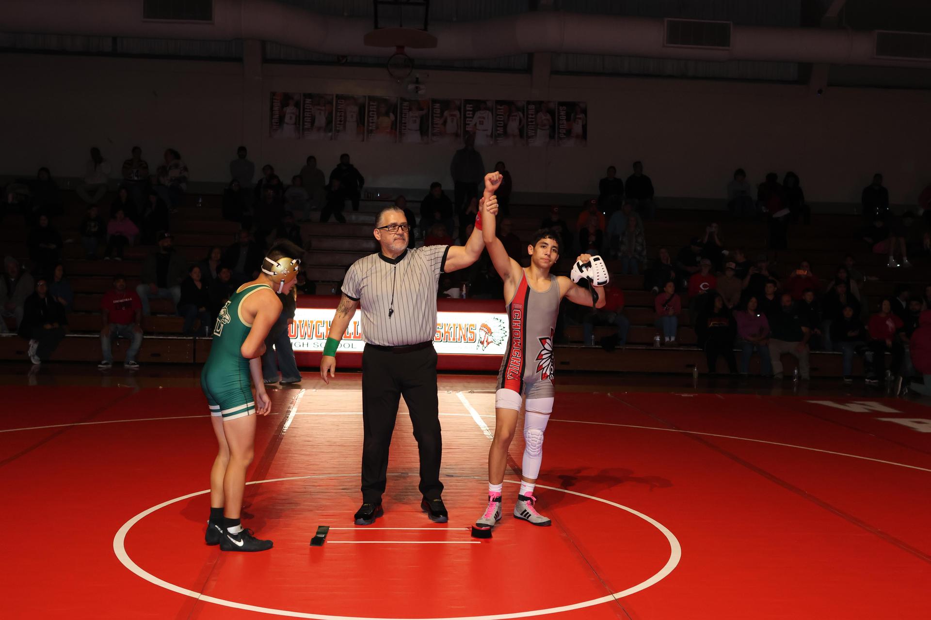 Wrestling winners with hands up 113