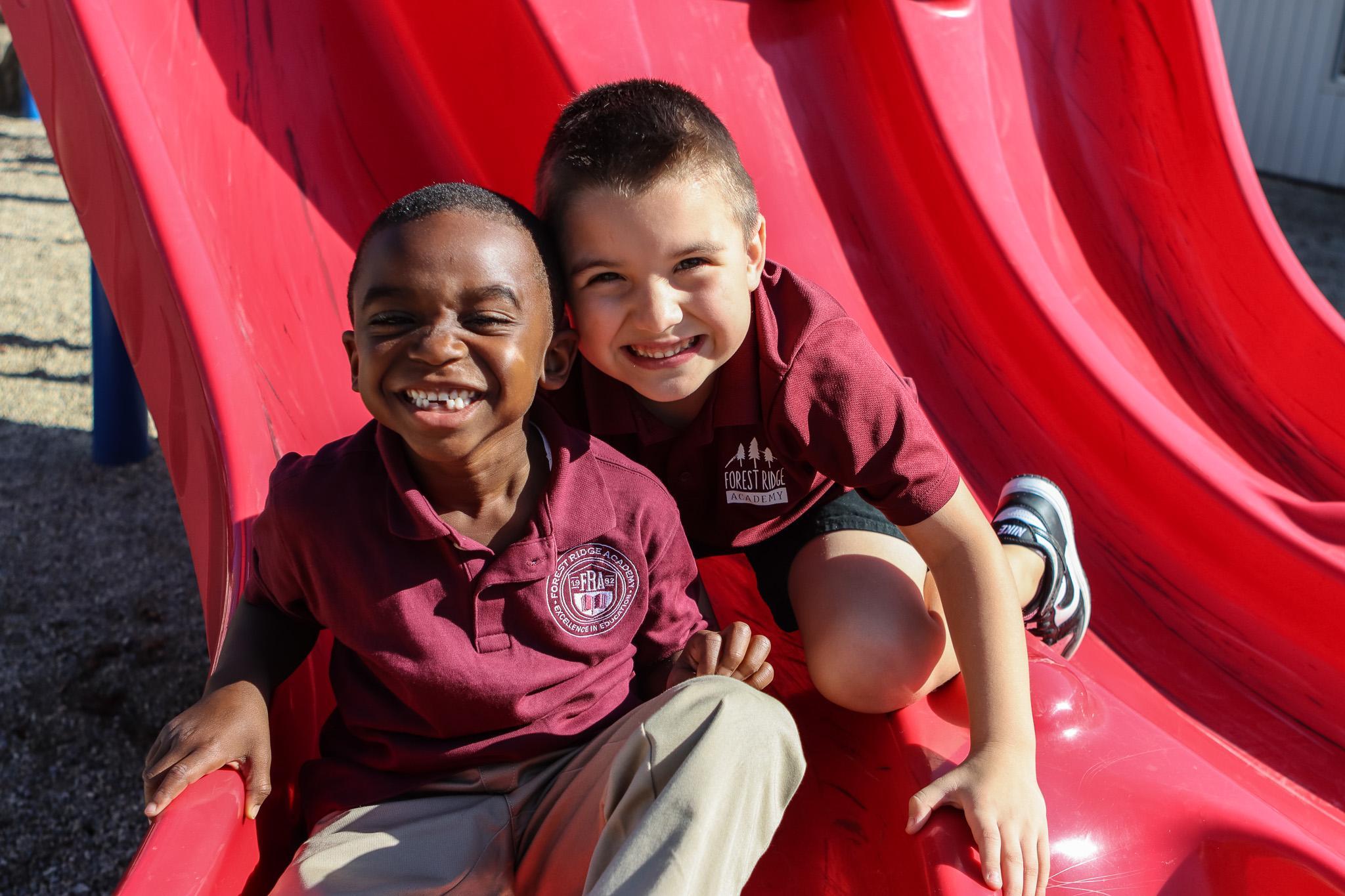 students on a red slide